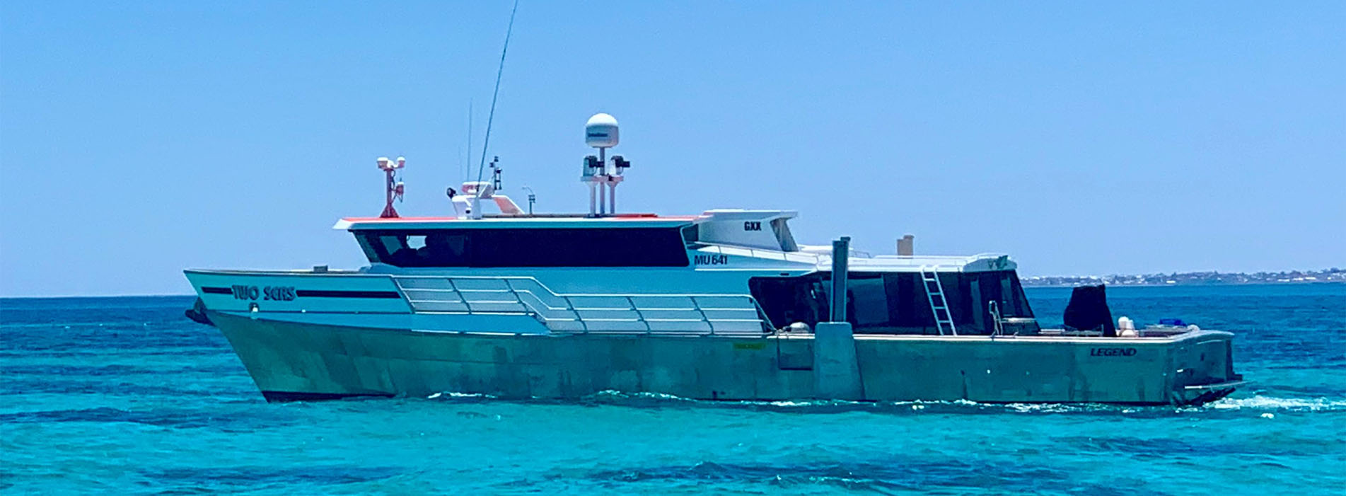 TWO SEAS hero profile side blue water