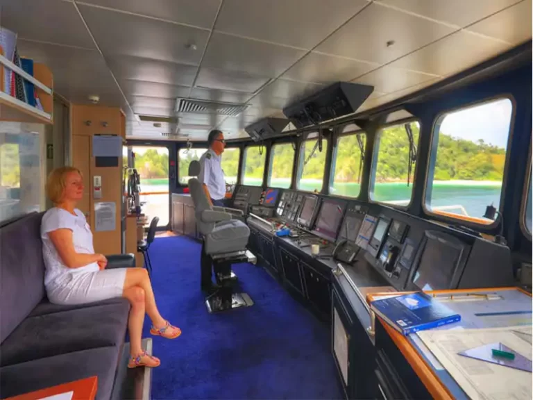CORAL-DISCOVERER-Cabins-bridge-lady-seated