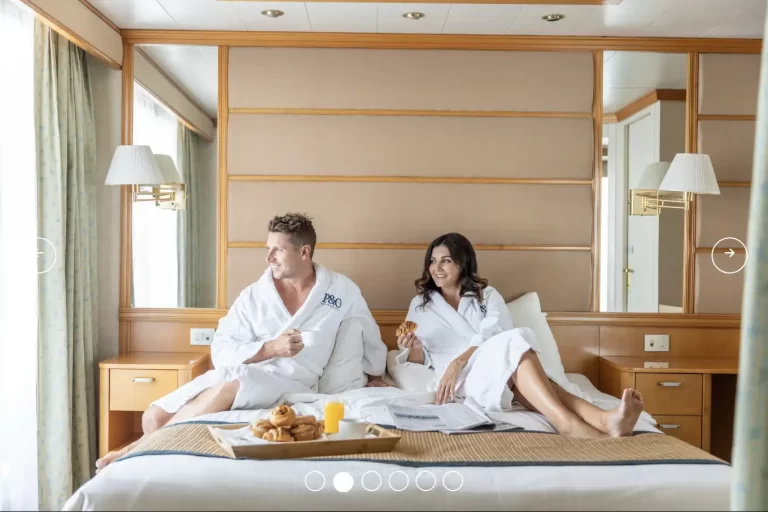 PACIFIC EXPLORER suites couple on bed