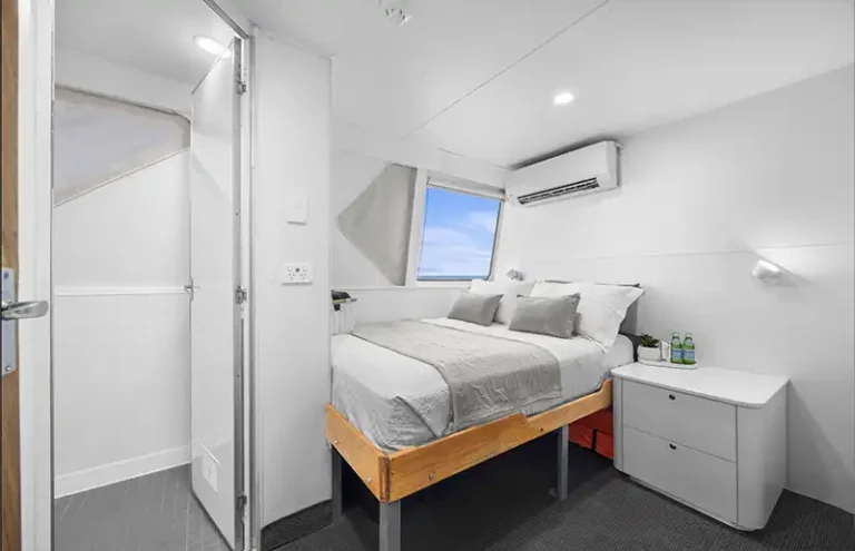 DIVERSITY II Flybridge bed side view with cabinet table