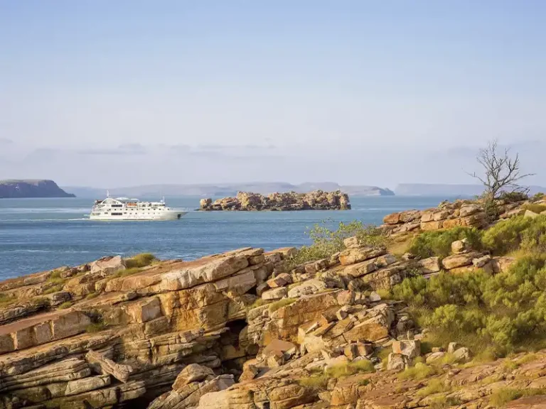 Coral Discoverer side profile in Kimberley bay